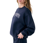 Lolë College Crew Neck Pullover in Outerspace navy — the College Crewneck pairs a relaxed fit with a soft, cozy feel