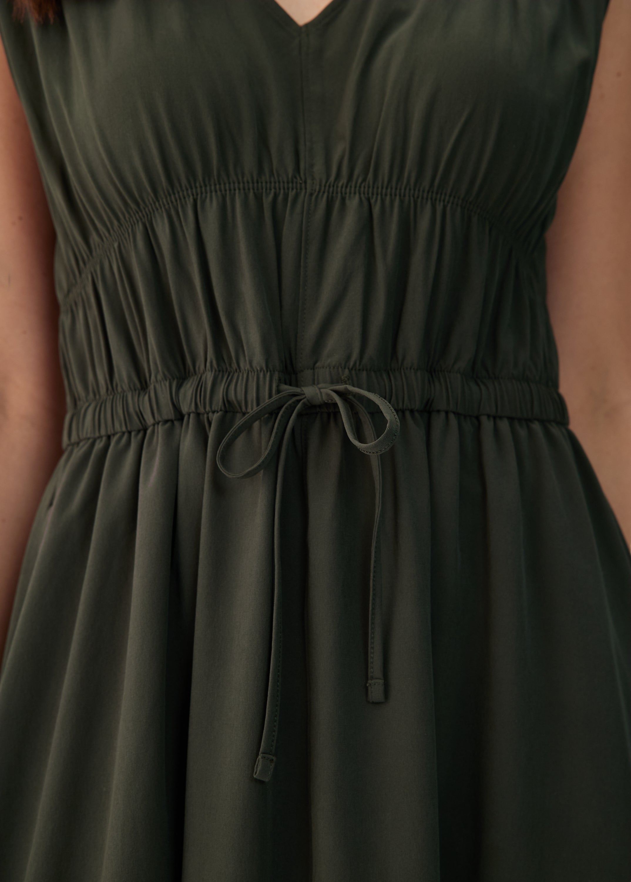 Lolë Momentum Ruched Midi Dress in olive — the dress that gets you out the door faster than your morning coffee