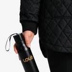 Lolë Refresh Water Bottle in black — features a wristlet strap for easy on-the-go hydration