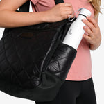 Lolë Refresh Water Bottle in white — features a wristlet strap for easy on-the-go hydration