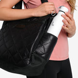 Lolë Refresh Water Bottle in white — features a wristlet strap for easy on-the-go hydration