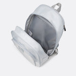 Lolë Chelsea backpack in pale grey, interior shot from above showing the lined main compartment and inner pocket