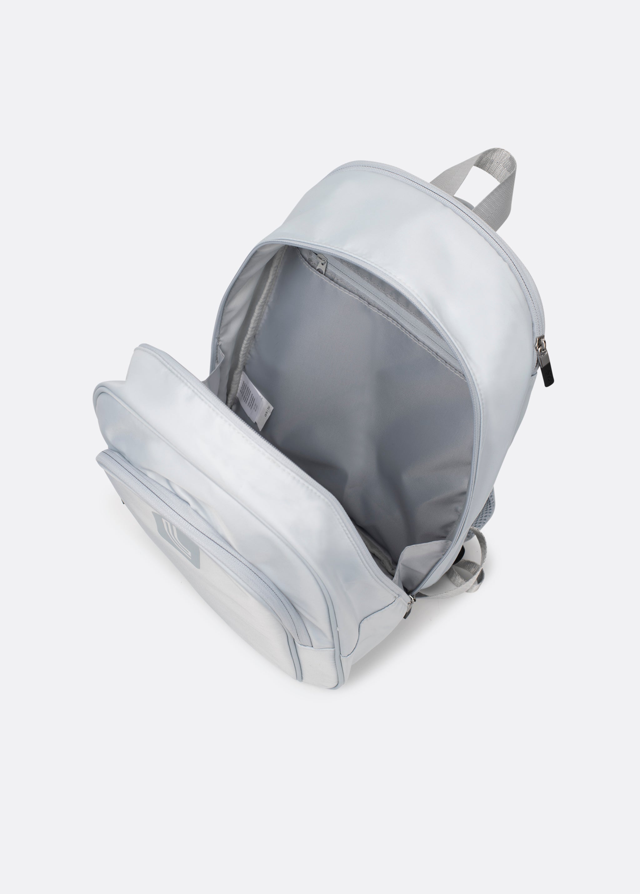 Lolë Chelsea backpack in pale grey, interior shot from above showing the lined main compartment and inner pocket