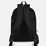 Lolë Chelsea backpack in black, rear product view of the padded shoulder straps and adjustable webbing