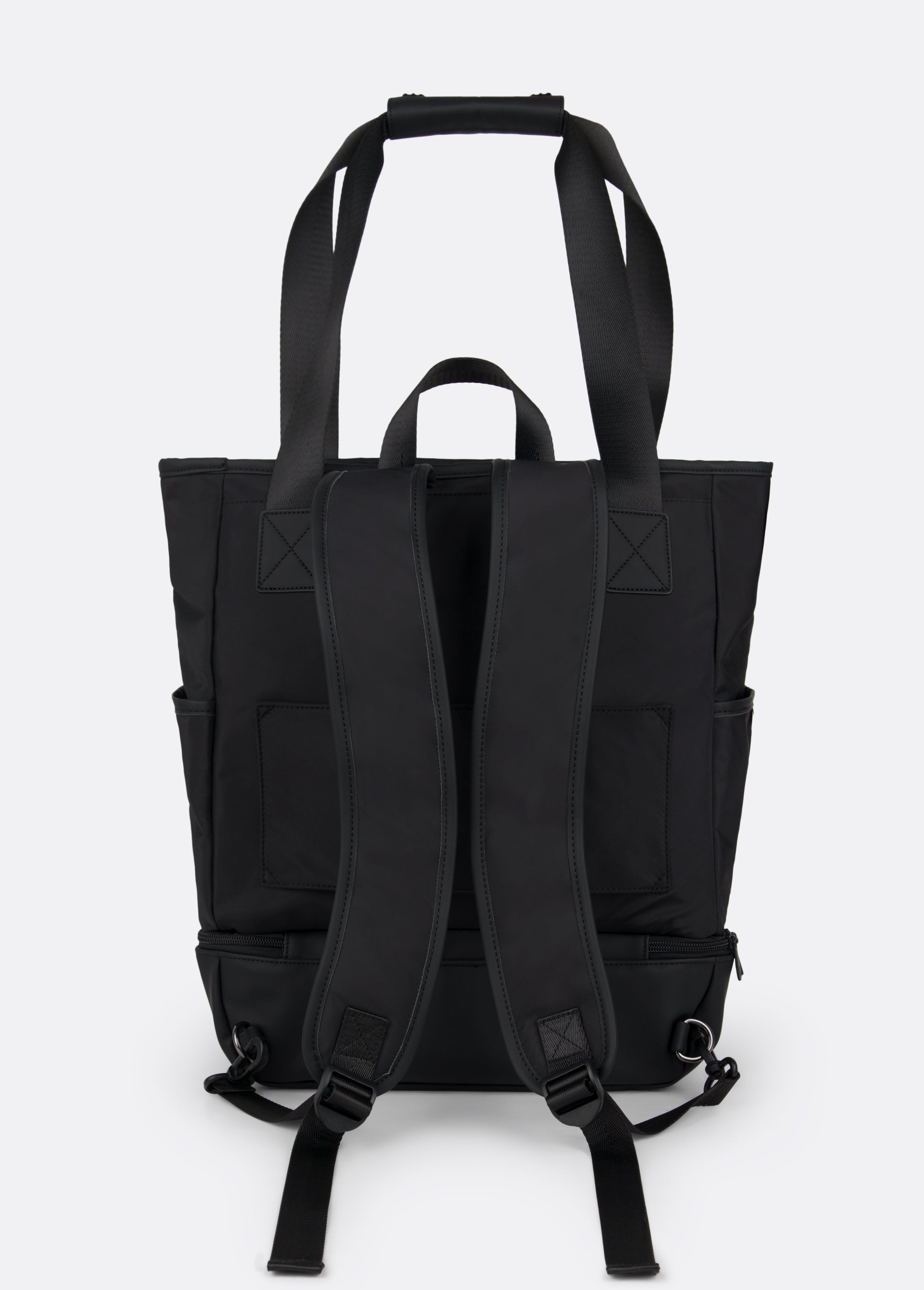 Lolë Lily 2.0 bag in black, standalone back view showing the padded backpack straps and long shoulder strap