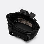 Lolë Lily 2.0 bag in black, overhead view into the open main compartment revealing the light interior lining