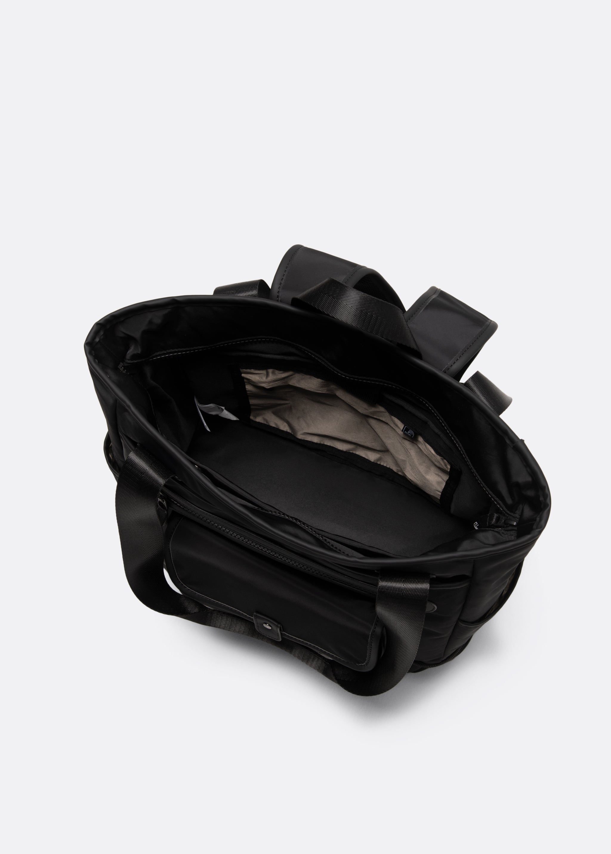 Lolë Lily 2.0 bag in black, overhead view into the open main compartment revealing the light interior lining