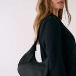 Lolë Mini Hobo Bag in black — consider this sleek bag elevated, inside and out