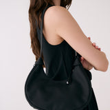 Lolë Mini Hobo Bag in black — consider this sleek bag elevated, inside and out