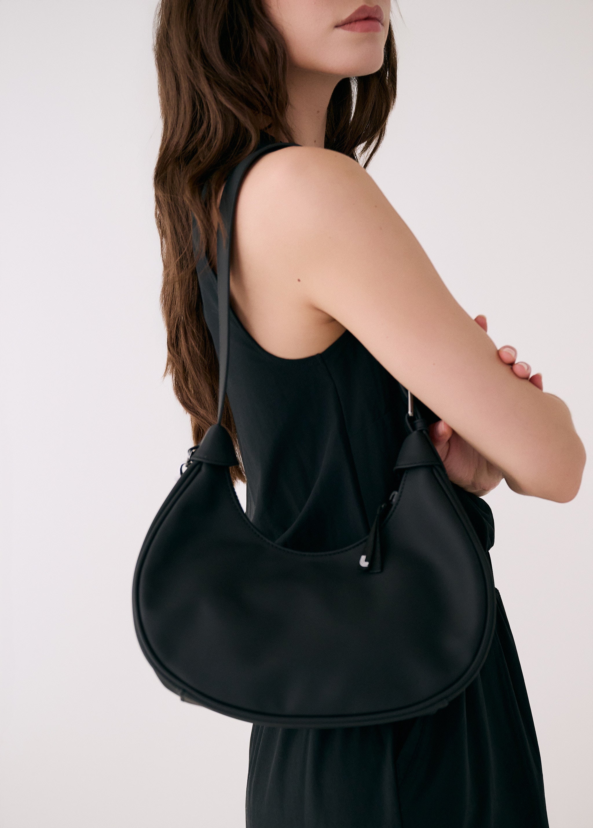 Lolë Mini Hobo Bag in black — consider this sleek bag elevated, inside and out