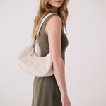 Lolë Mini Hobo Bag in Birch cream — consider this sleek bag elevated, inside and out