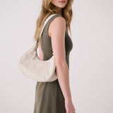 Lolë Mini Hobo Bag in Birch cream — consider this sleek bag elevated, inside and out