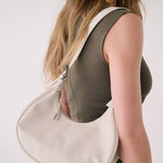 Lolë Mini Hobo Bag in Birch cream — consider this sleek bag elevated, inside and out