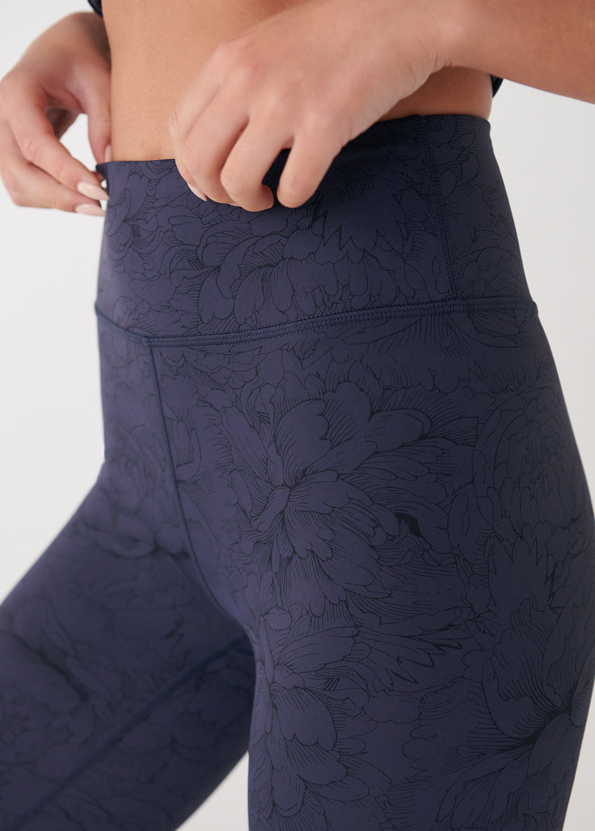 Lolë Serene Ankle Leggings in navy floral print — pair it with a Serene tank or bra to complete the set