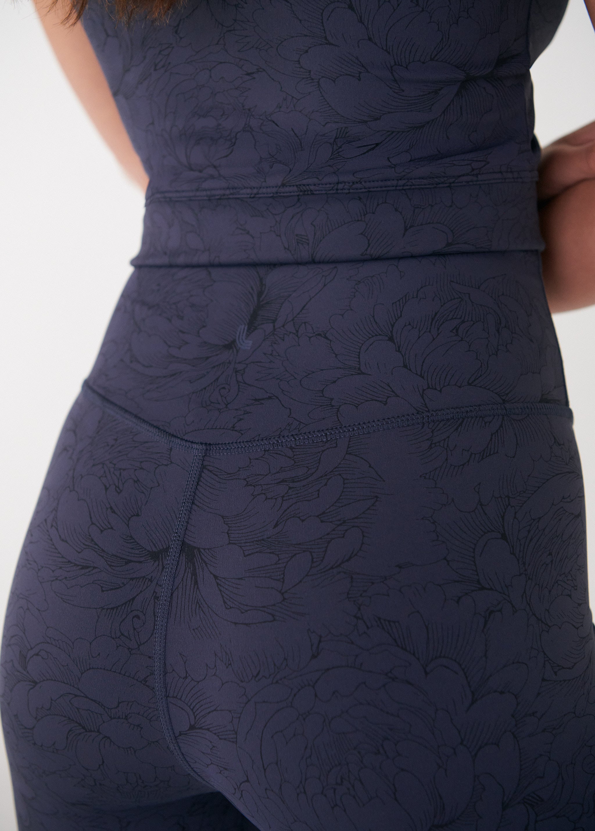Lolë Serene Ankle Leggings in navy floral print — pair it with a Serene tank or bra to complete the set