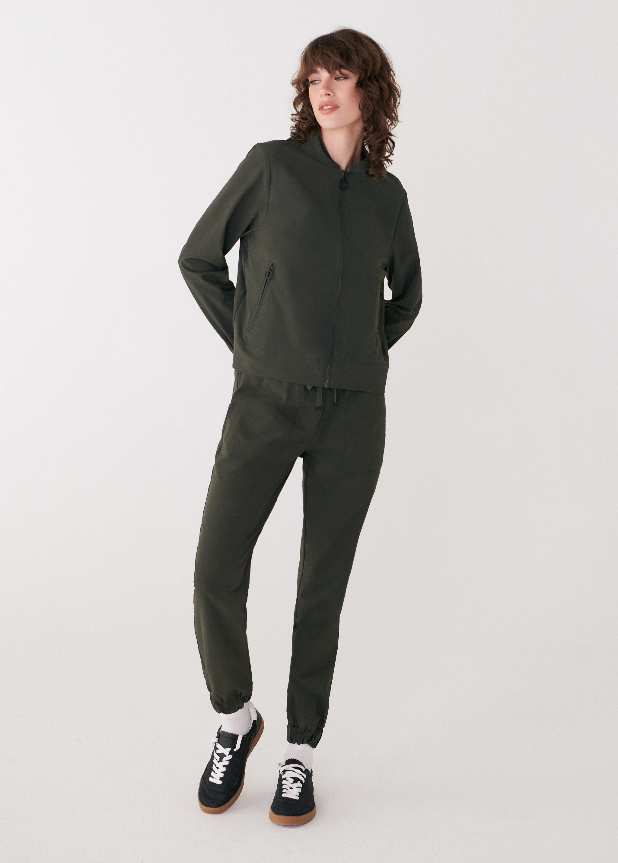 Lolë Momentum Tech Bomber in olive — pair it with the matching pant for an easy total look