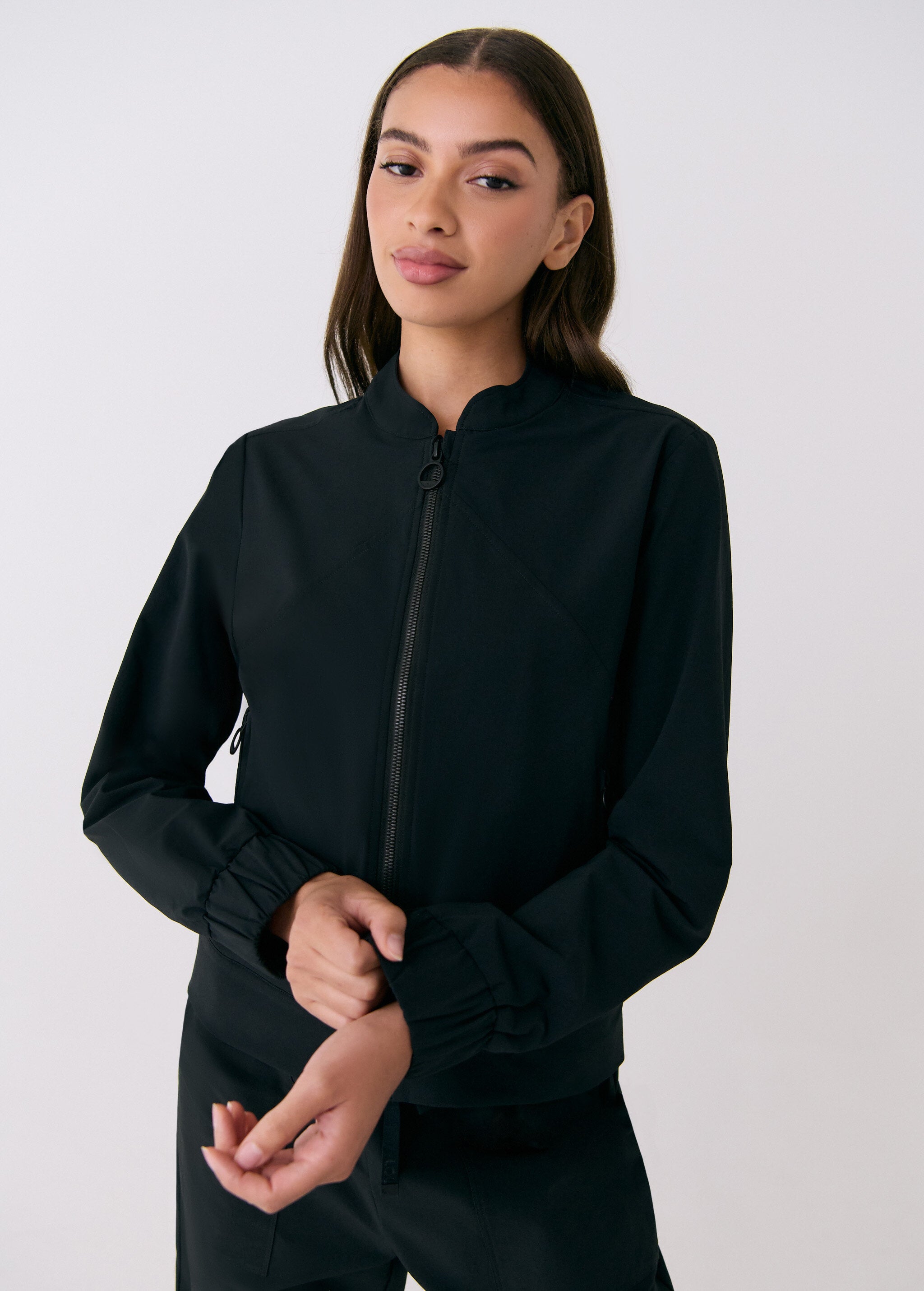 Lolë Momentum Tech Bomber in black — pair it with the matching pant for an easy total look