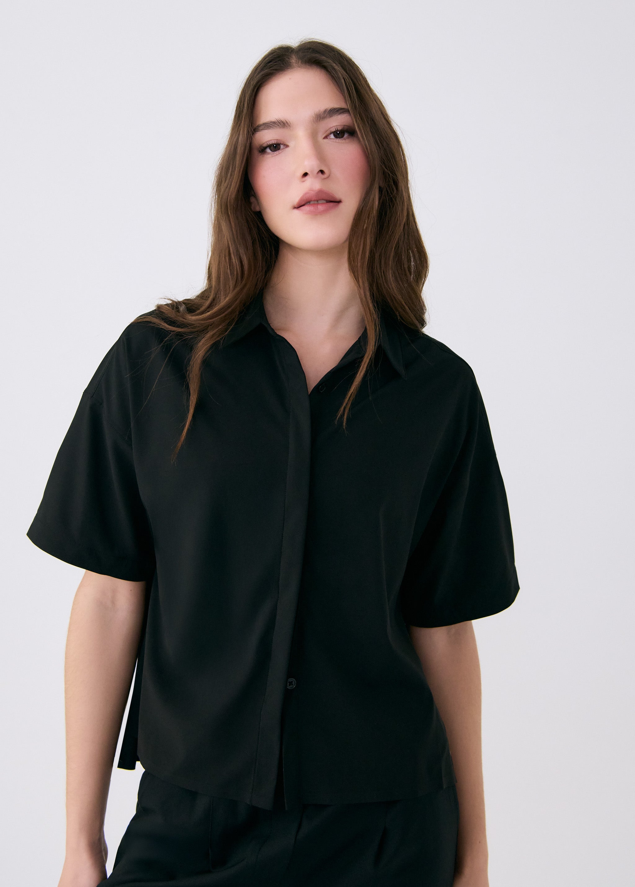 Lolë Olivie Button Up Shirt in black — button up in style with this lightweight, breathable shirt