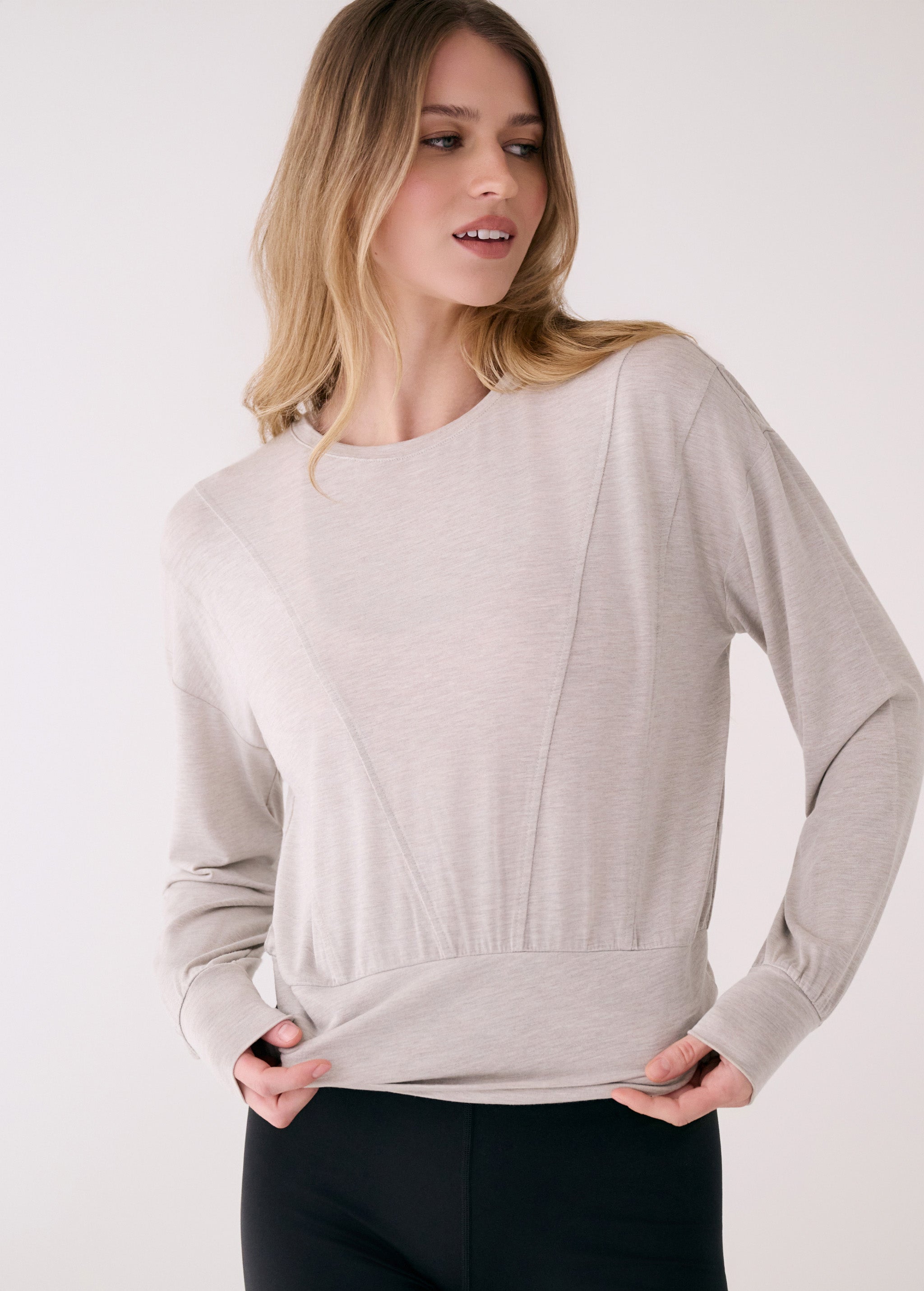 Lolë Elisia Long Sleeve in light grey — a long sleeve with a little extra built in