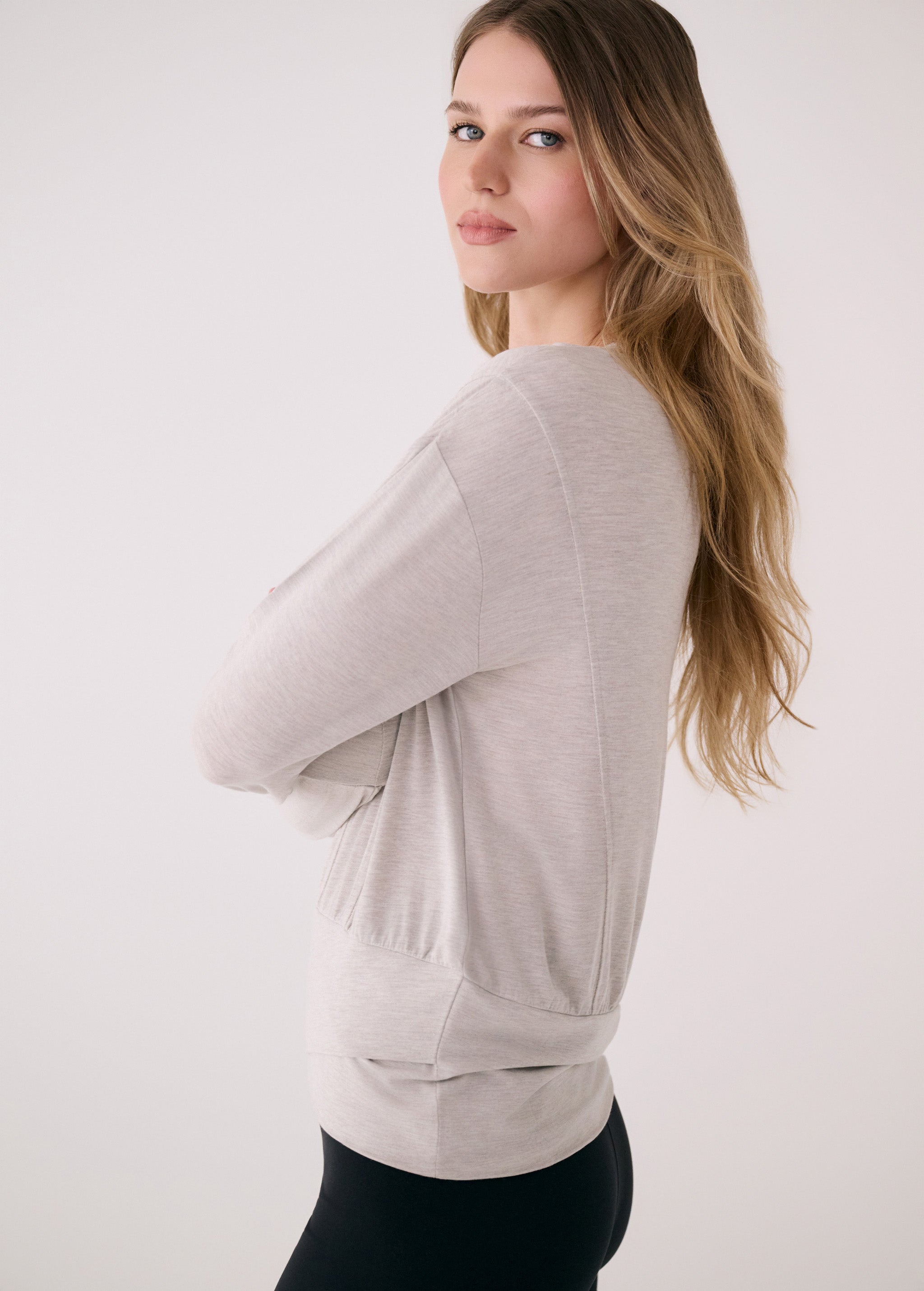 Lolë Elisia Long Sleeve in light grey — a long sleeve with a little extra built in