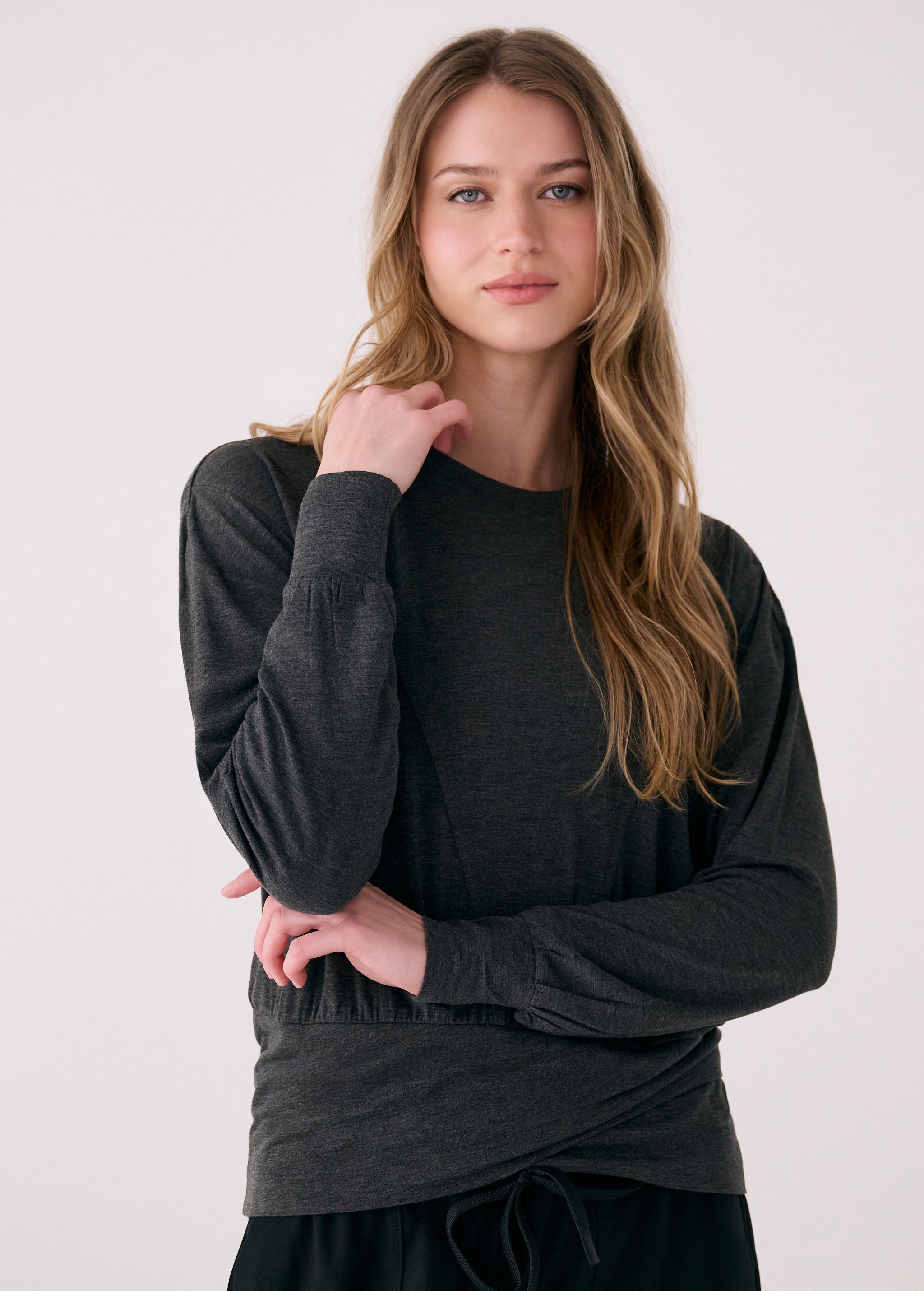 Lolë Elisia Long Sleeve in black — a long sleeve with a little extra built in