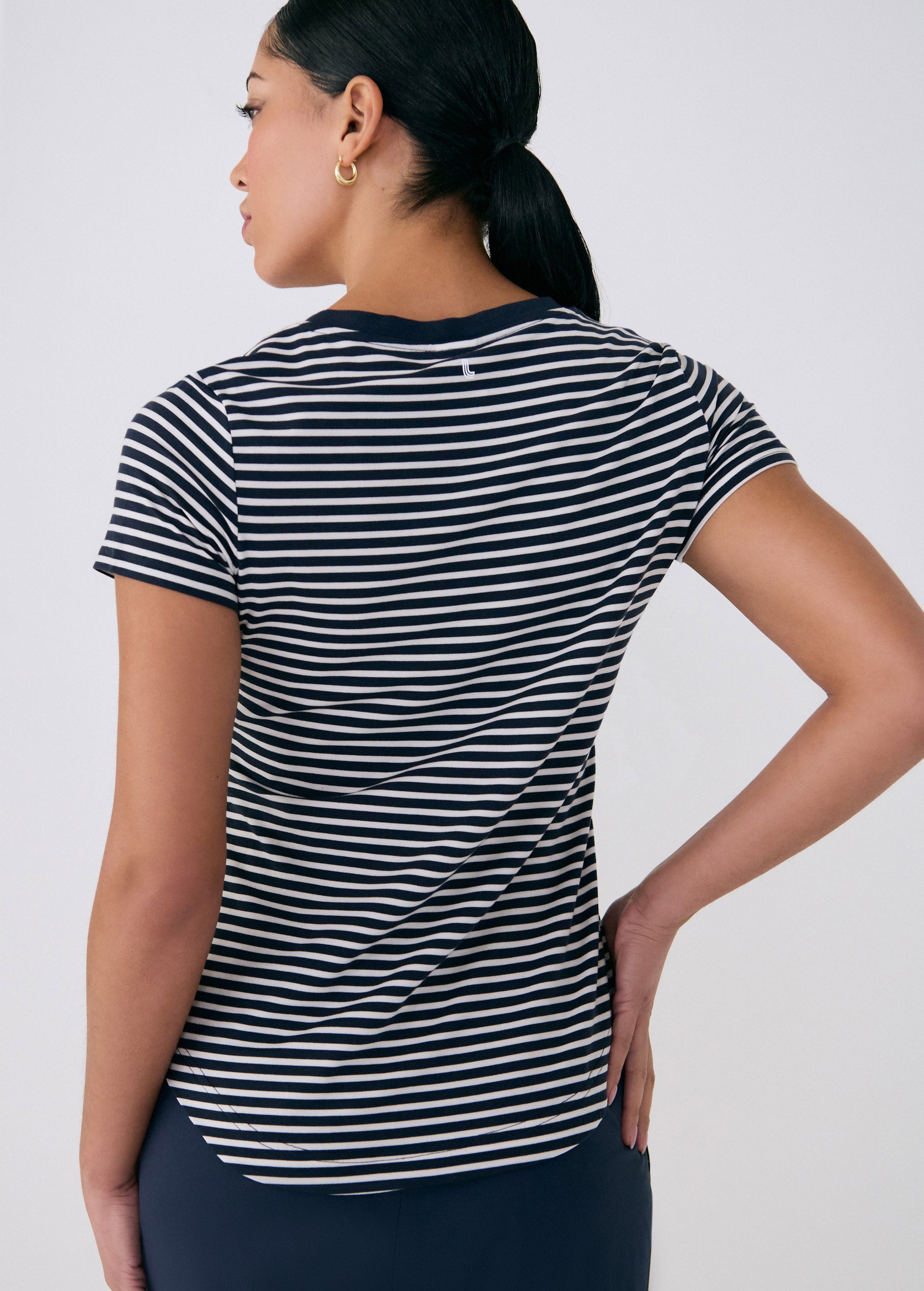 Lolë Dynamic V-neck in navy stripe — this V-neck tee proves that everyday essentials can still feel special