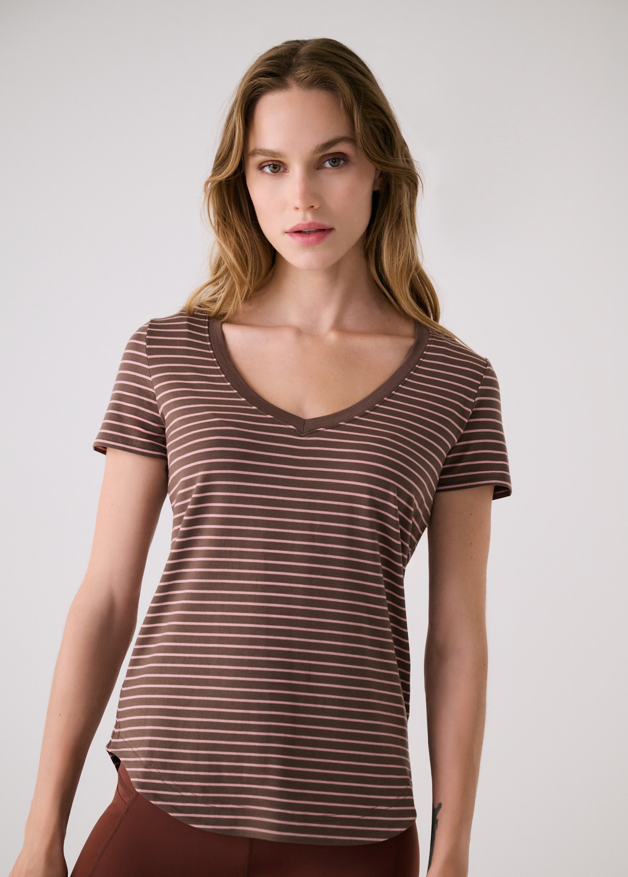 Lolë Dynamic V-neck in brown stripe — this V-neck tee proves that everyday essentials can still feel special