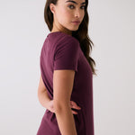 Lolë Dynamic V-neck in burgundy — this V-neck tee proves that everyday essentials can still feel special