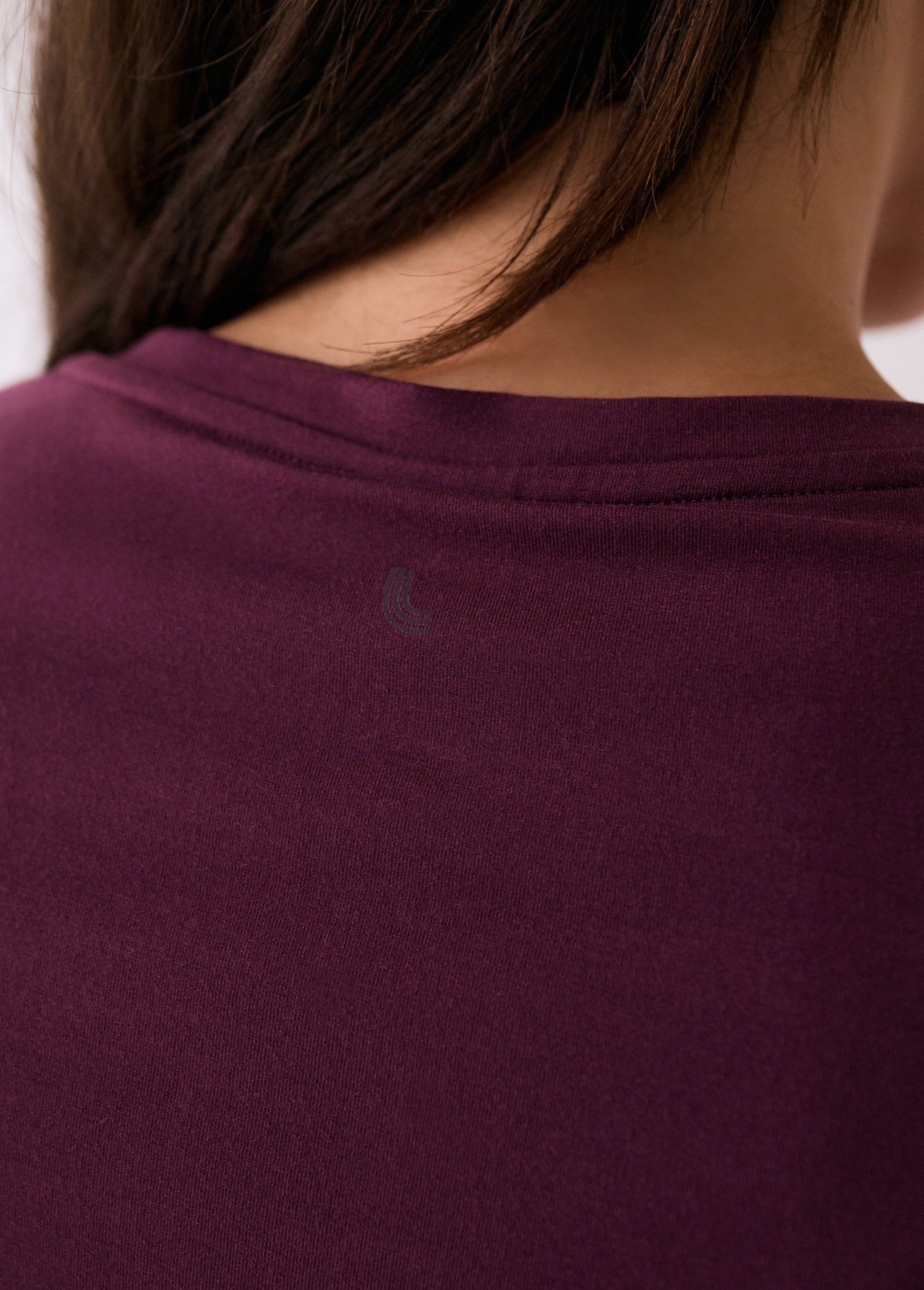 Lolë Dynamic V-neck in burgundy — this V-neck tee proves that everyday essentials can still feel special