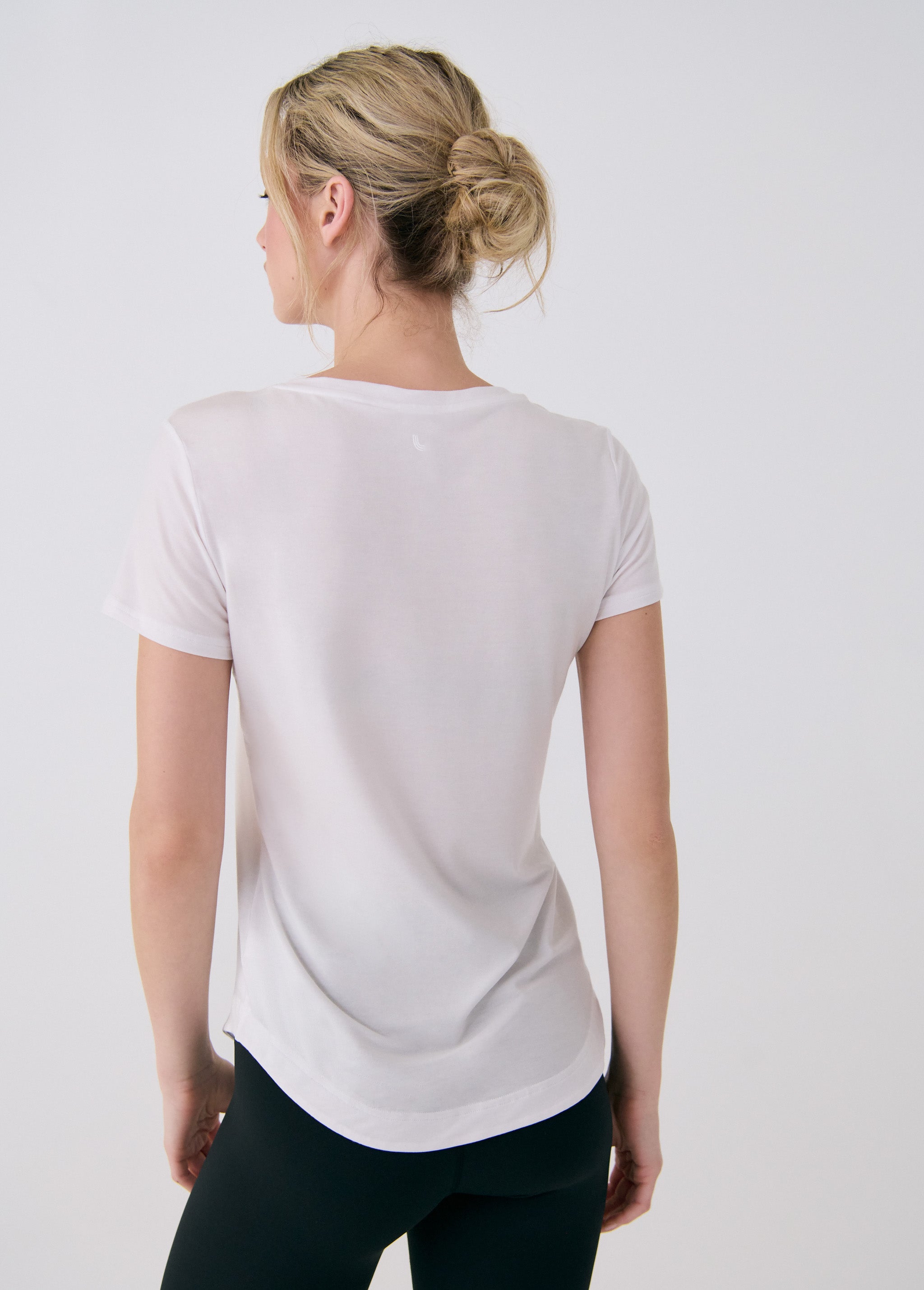 Lolë Dynamic V-neck in white — this V-neck tee proves that everyday essentials can still feel special