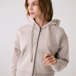 Lolë Yonder Full Zip Hoodie in Abalone pale greige — cropped and cozy, the Yonder Hoodie is your cold-weather comfort zone
