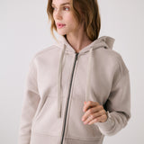 Lolë Yonder Full Zip Hoodie in Abalone pale greige — cropped and cozy, the Yonder Hoodie is your cold-weather comfort zone