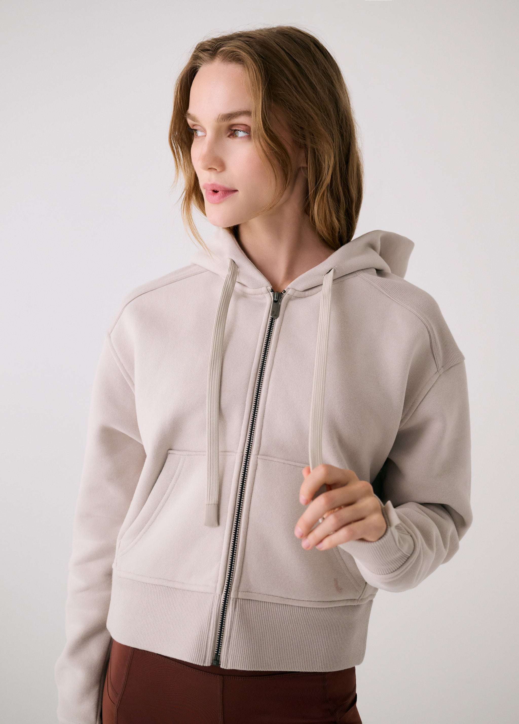 Lolë Yonder Full Zip Hoodie in Abalone pale greige — cropped and cozy, the Yonder Hoodie is your cold-weather comfort zone