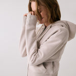Lolë Yonder Full Zip Hoodie in Abalone pale greige — cropped and cozy, the Yonder Hoodie is your cold-weather comfort zone