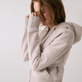Lolë Yonder Full Zip Hoodie in Abalone pale greige — cropped and cozy, the Yonder Hoodie is your cold-weather comfort zone