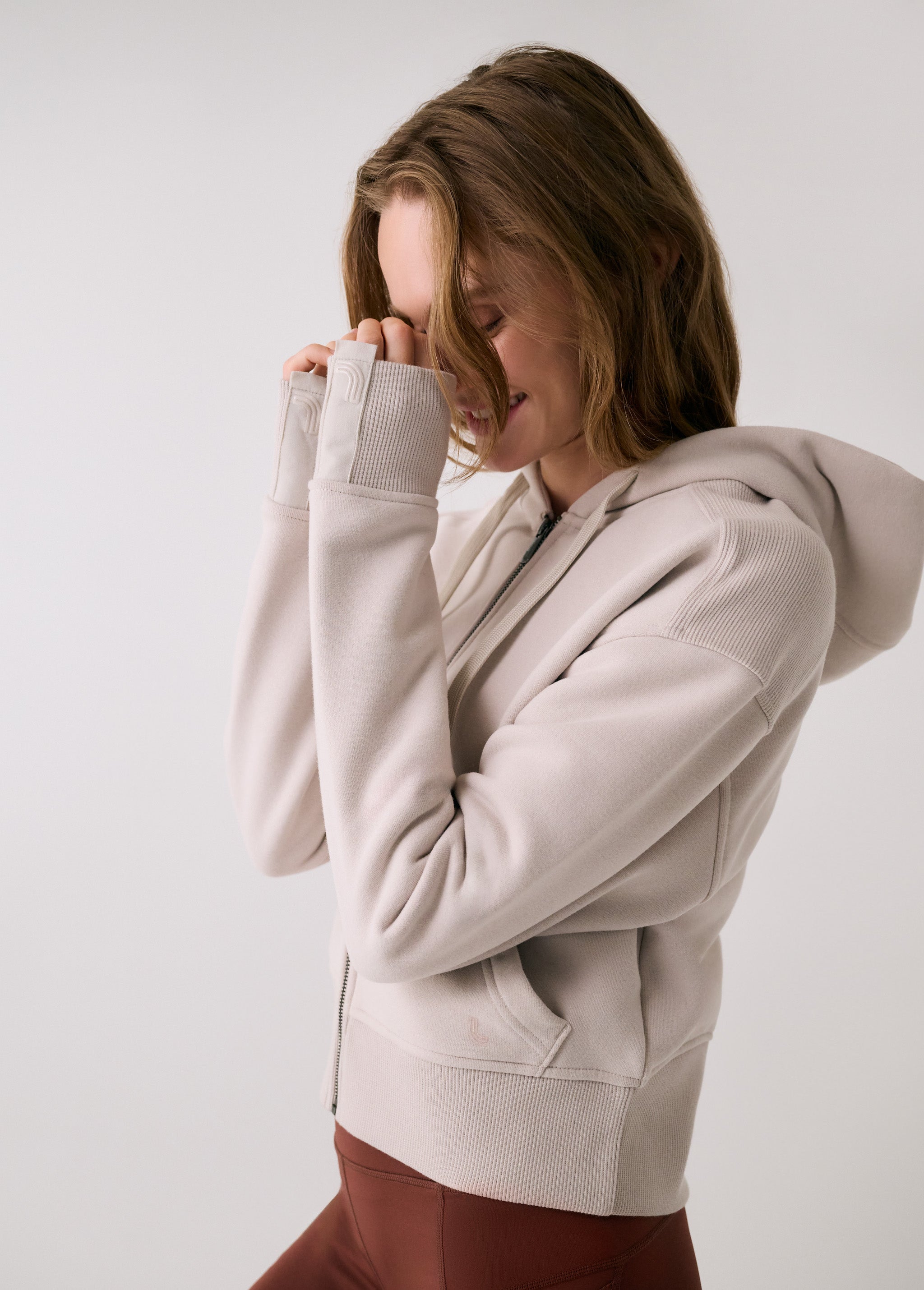 Lolë Yonder Full Zip Hoodie in Abalone pale greige — cropped and cozy, the Yonder Hoodie is your cold-weather comfort zone
