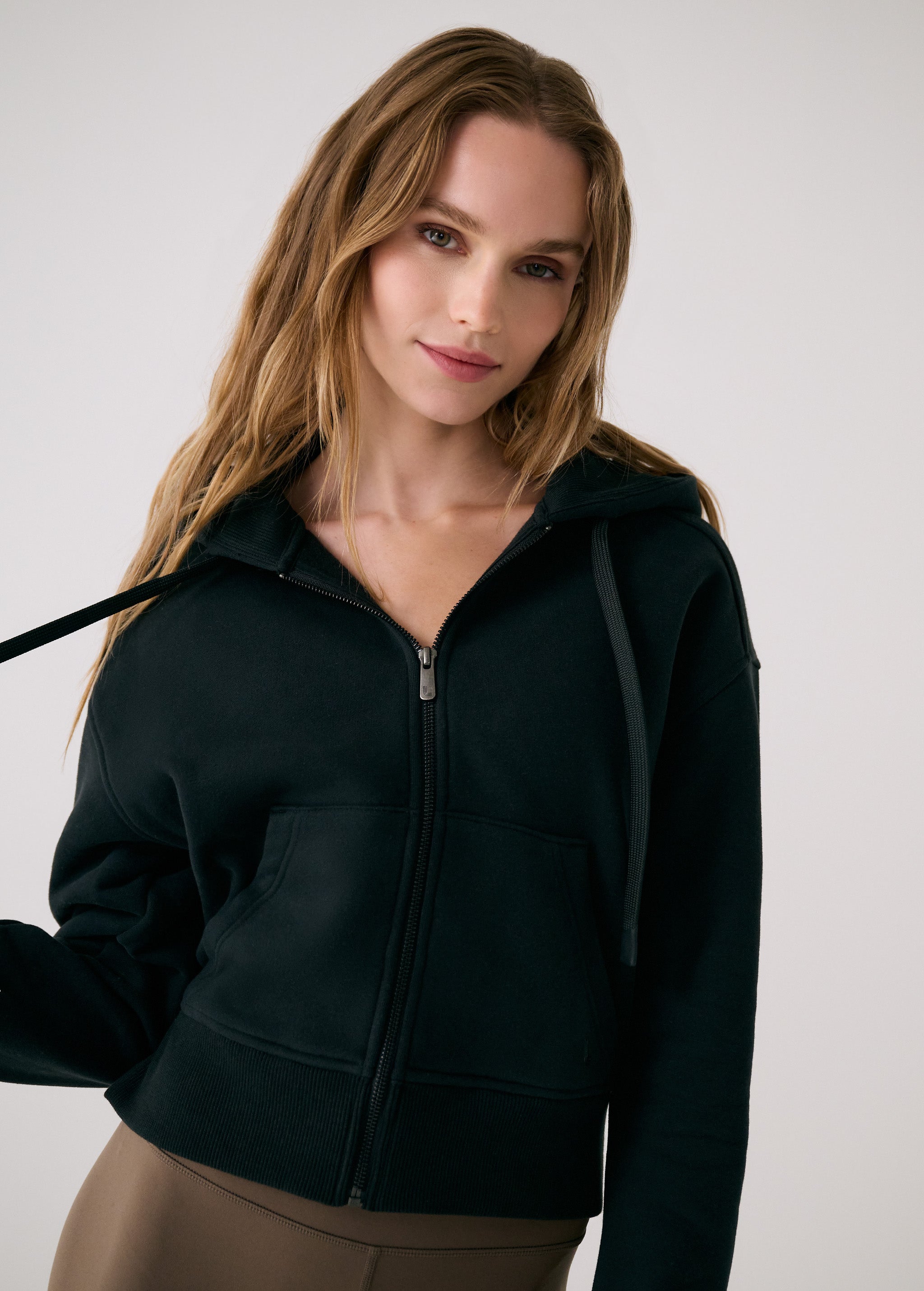 Lolë Yonder Full Zip Hoodie in black — cropped and cozy, the Yonder Hoodie is your cold-weather comfort zone