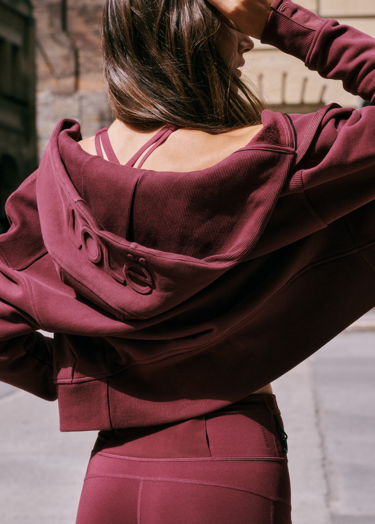 Lolë Yonder Full Zip Hoodie in burgundy — cropped and cozy, the Yonder Hoodie is your cold-weather comfort zone