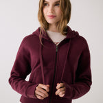 Lolë Yonder Full Zip Hoodie in burgundy — cropped and cozy, the Yonder Hoodie is your cold-weather comfort zone