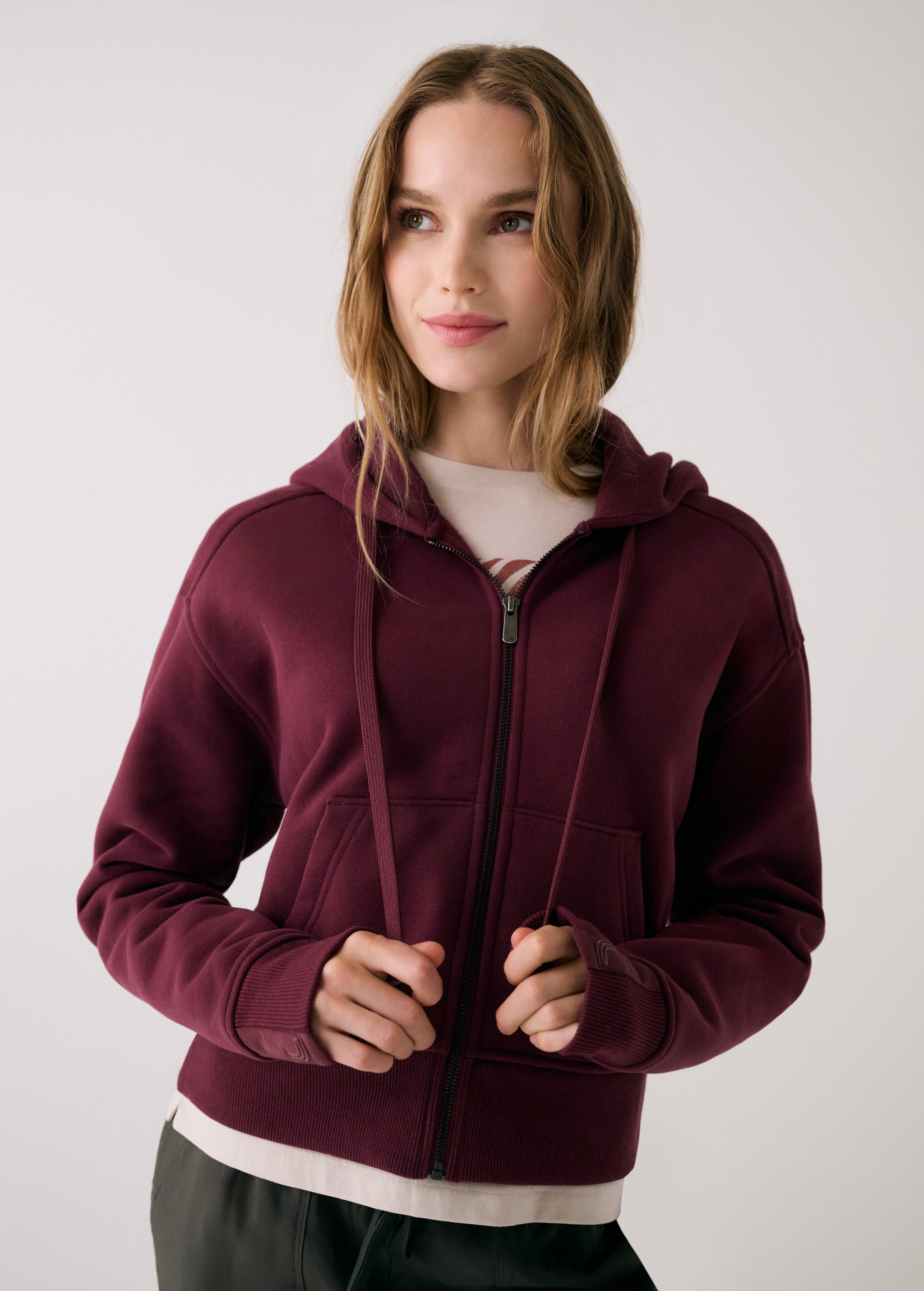 Lolë Yonder Full Zip Hoodie in burgundy — cropped and cozy, the Yonder Hoodie is your cold-weather comfort zone