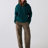 Lolë Yonder Full Zip Hoodie in teal — cropped and cozy, the Yonder Hoodie is your cold-weather comfort zone