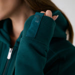 Lolë Yonder Full Zip Hoodie in teal — cropped and cozy, the Yonder Hoodie is your cold-weather comfort zone