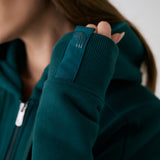 Lolë Yonder Full Zip Hoodie in teal — cropped and cozy, the Yonder Hoodie is your cold-weather comfort zone