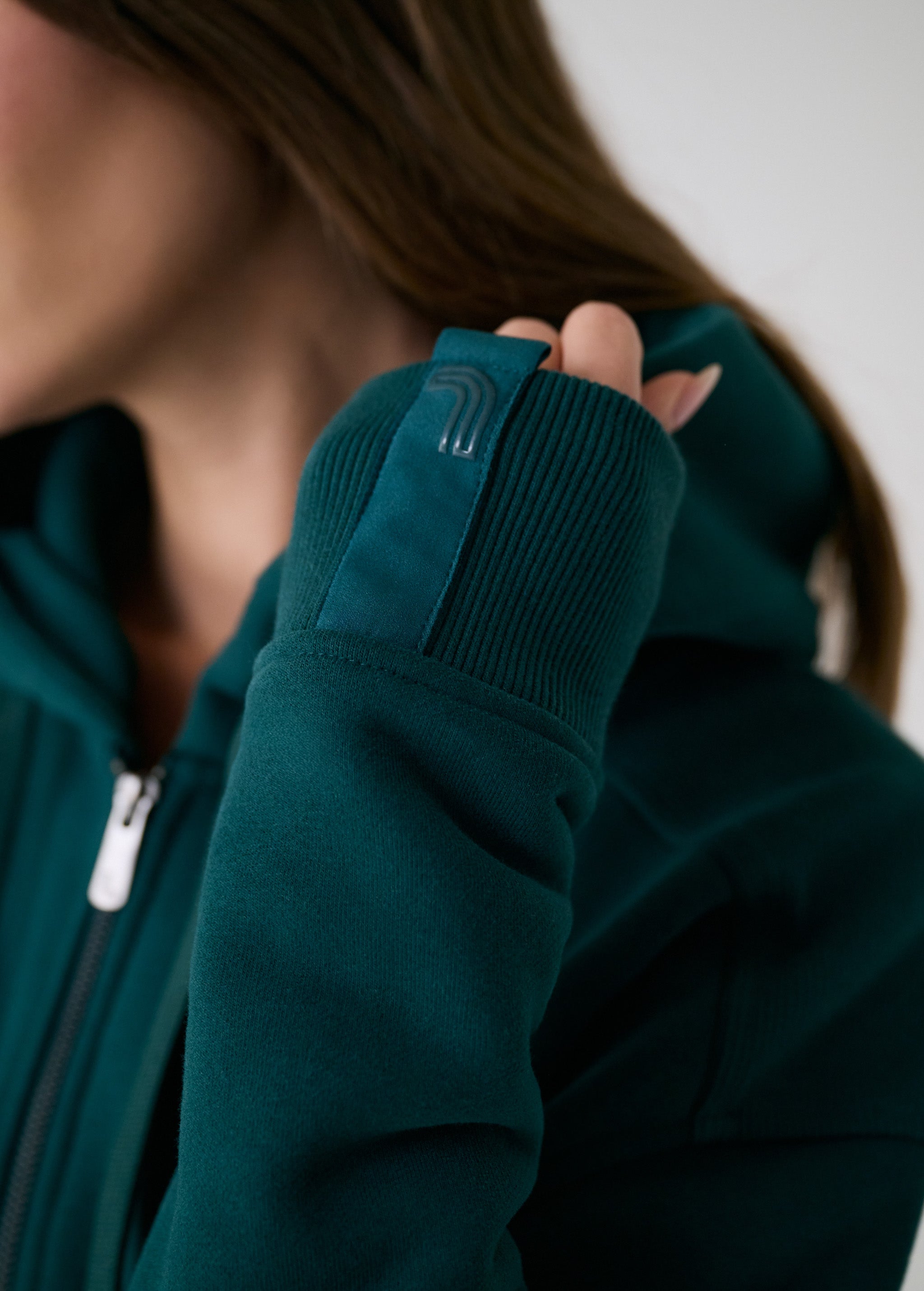 Lolë Yonder Full Zip Hoodie in teal — cropped and cozy, the Yonder Hoodie is your cold-weather comfort zone