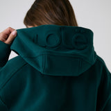 Lolë Yonder Full Zip Hoodie in teal — cropped and cozy, the Yonder Hoodie is your cold-weather comfort zone
