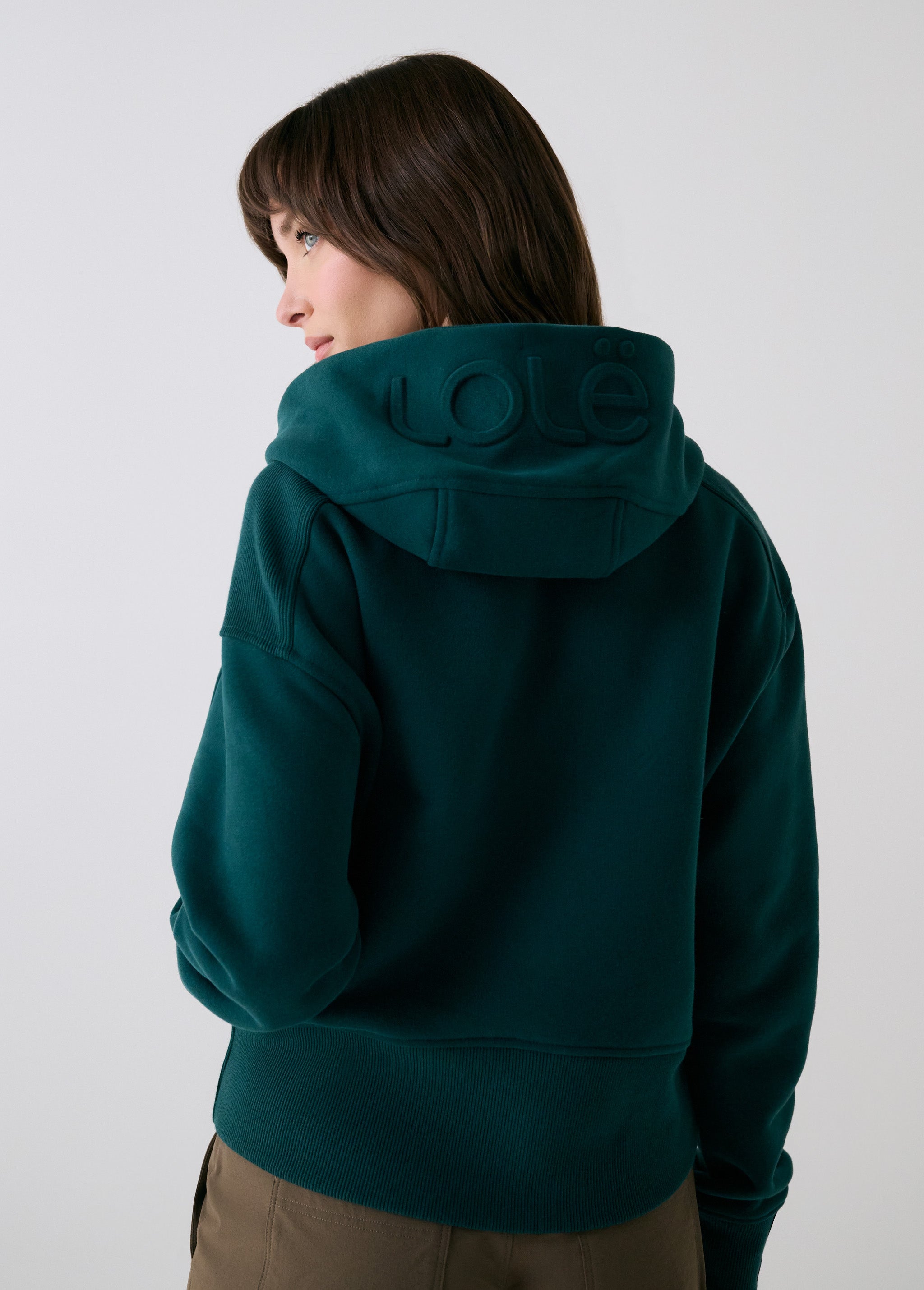 Lolë Yonder Full Zip Hoodie in teal — cropped and cozy, the Yonder Hoodie is your cold-weather comfort zone