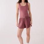Lolë Serene Support tank top in berry, front view on model — fitted scoop-neck