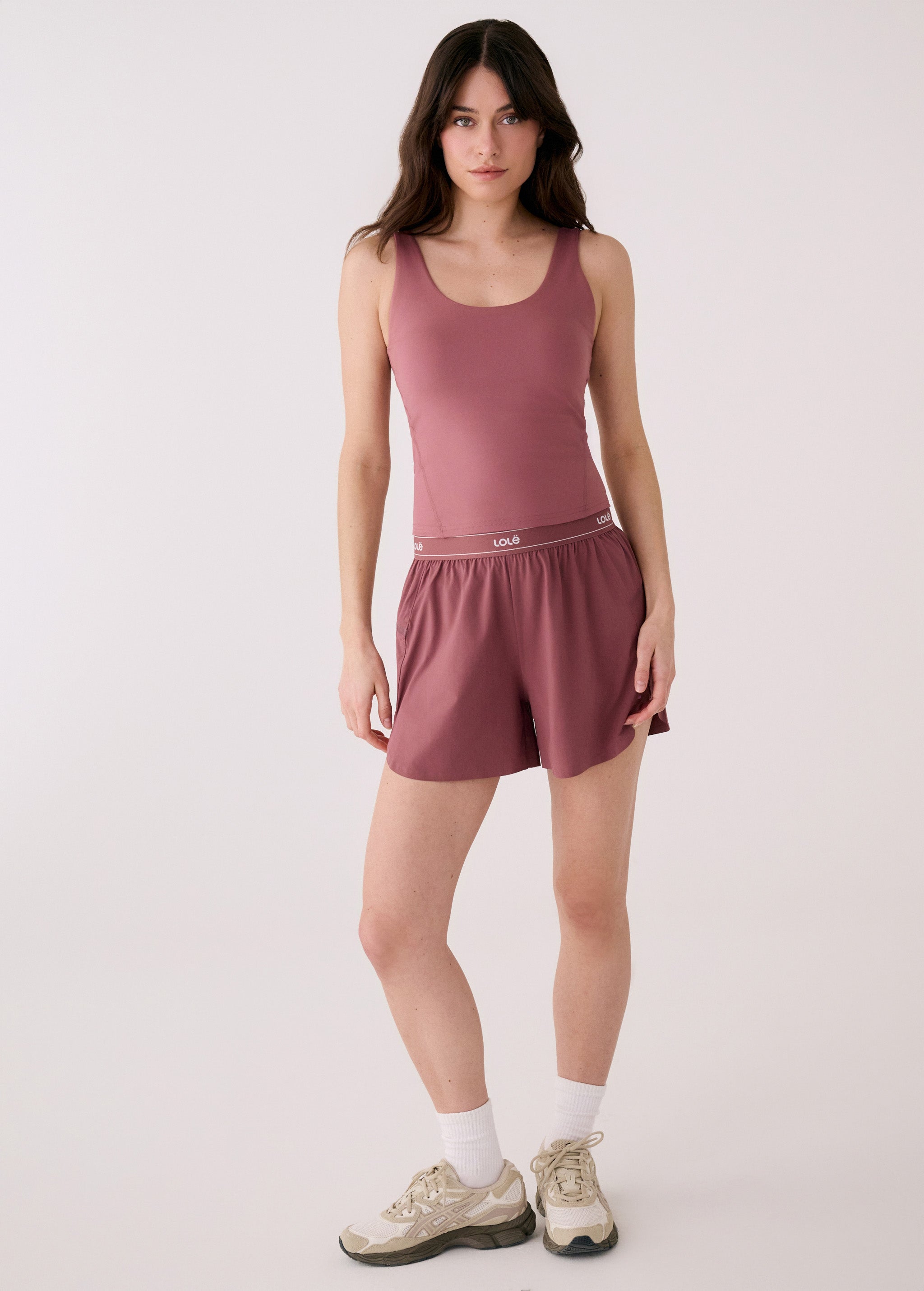 Lolë Serene Support tank top in berry, front view on model — fitted scoop-neck