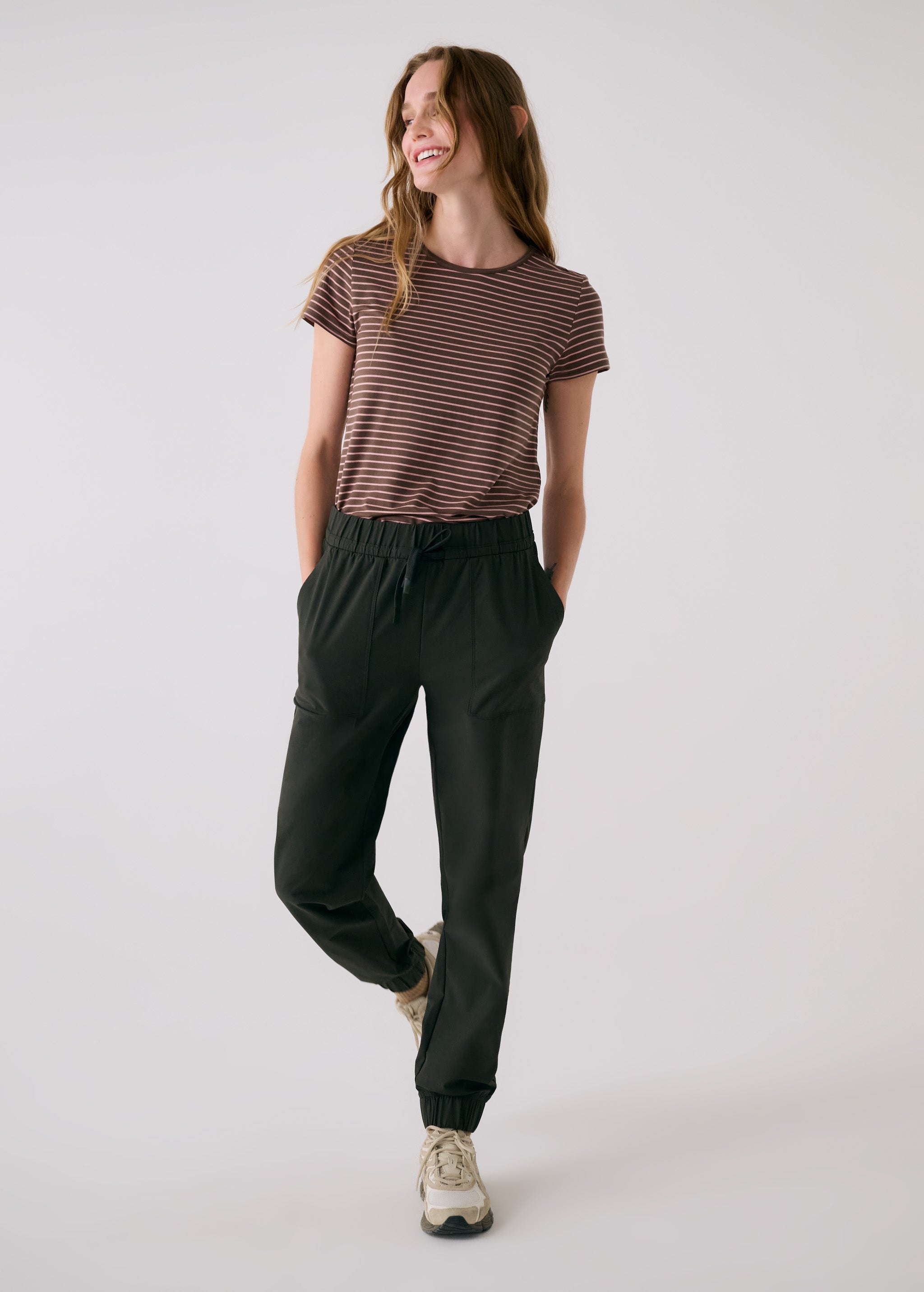 Lolë Olivie Tech Joggers in olive — if features a regular rise and relaxed fit with adjustable waistband