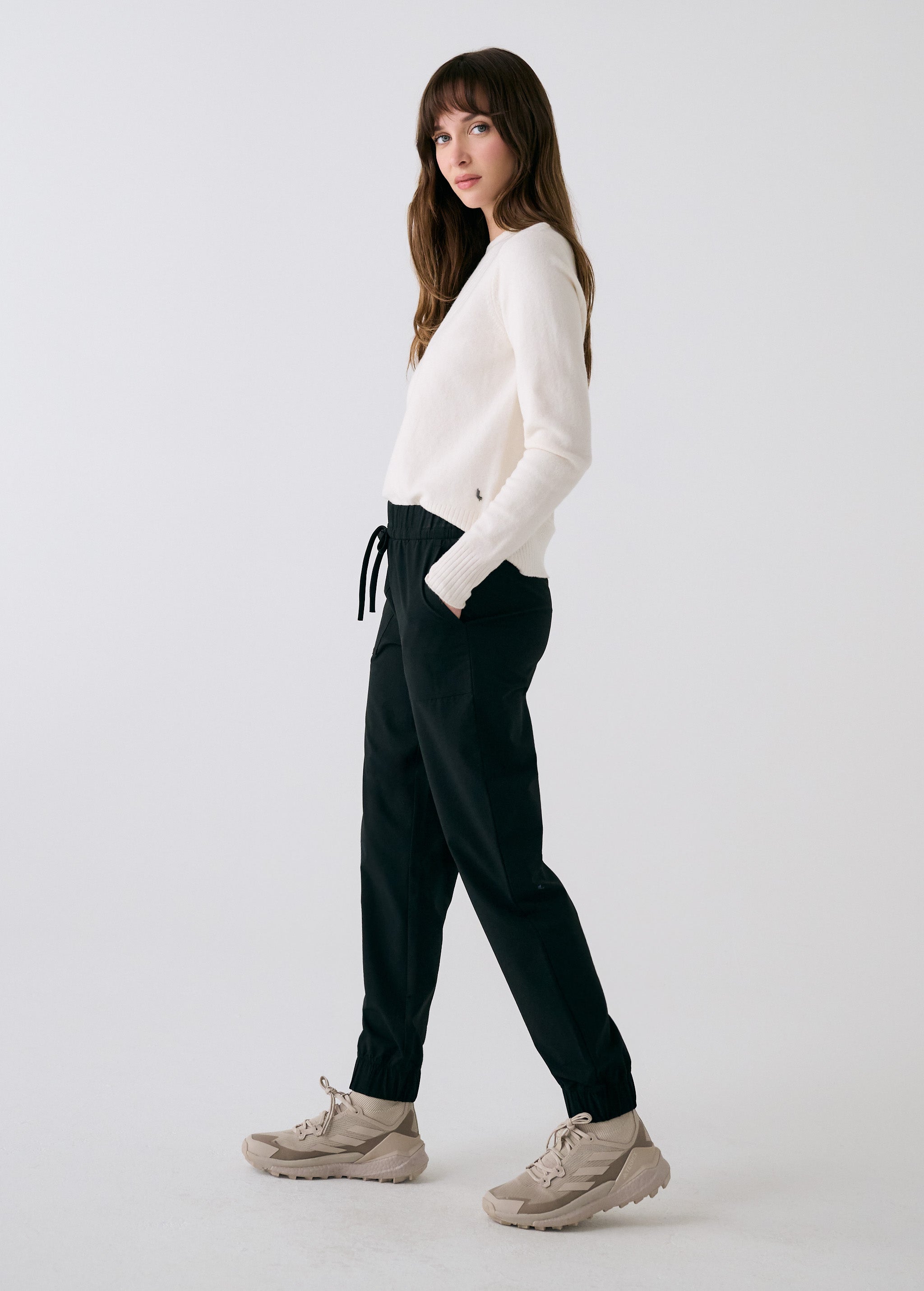 Lolë Olivie Tech Joggers in black — if features a regular rise and relaxed fit with adjustable waistband